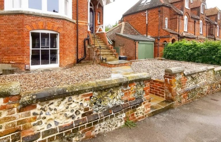 Flintstone wall repaired by Nu-Bourne Landscapes on a period property in Nu-Bourne Landscapes